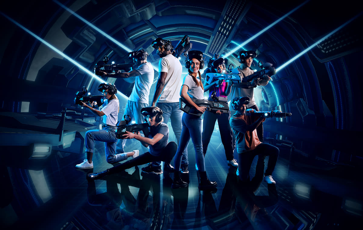 A group wearing headsets and playing a free-roam VR experience